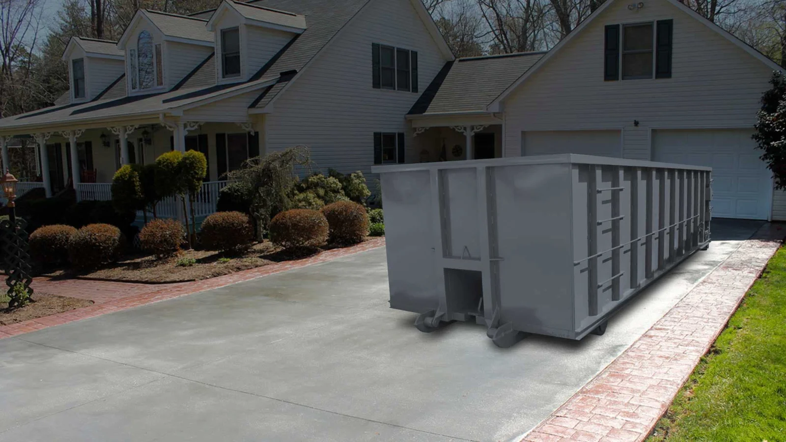 Roll off dumpster in a residential driveway